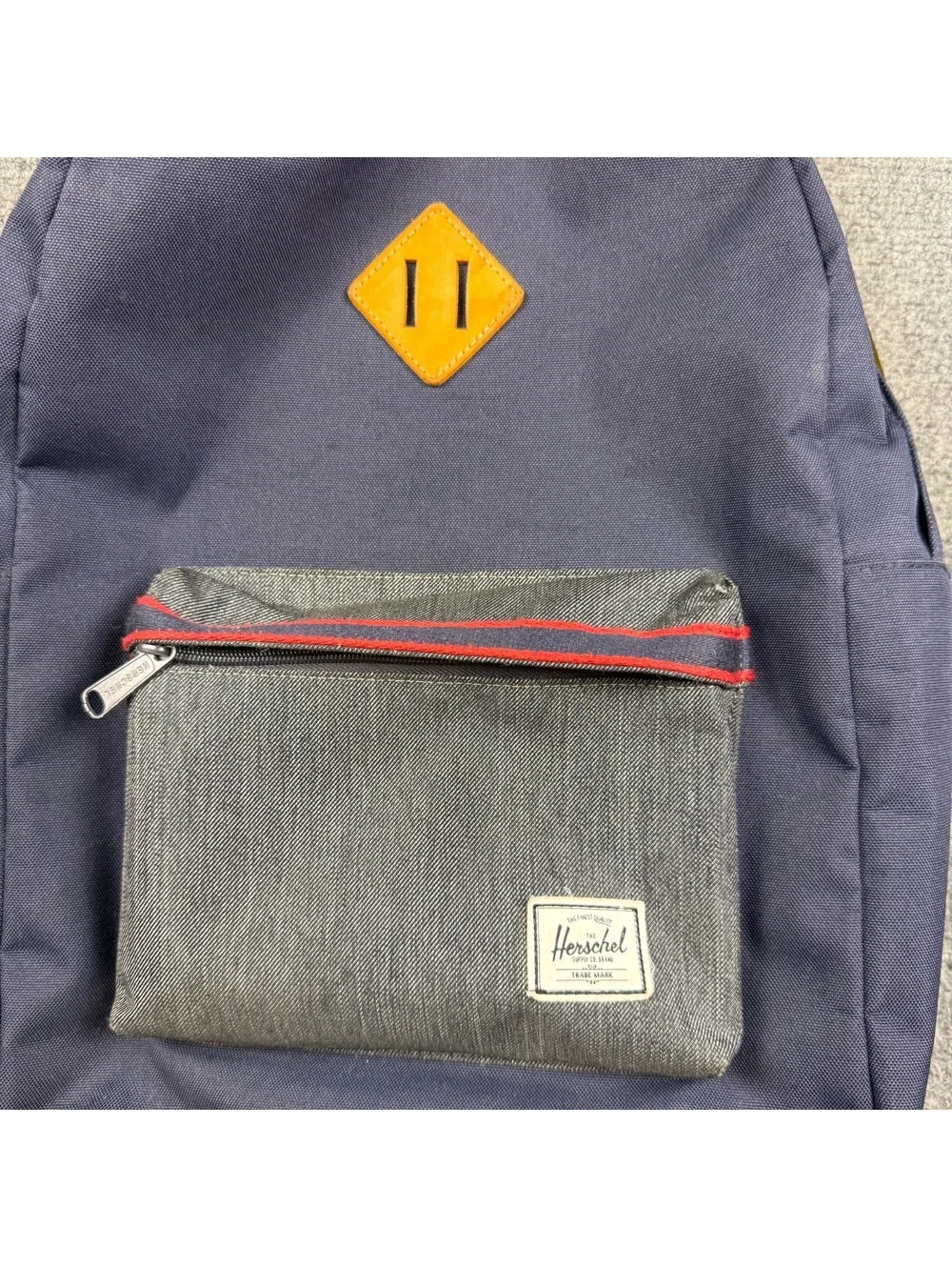 Herschel Navy Blue Backpack with Front Pocket and Red Striped Interior
